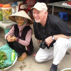 Dr. Robson visits with farmers in rural Vietnam to discuss rice production and pesticide exposure.